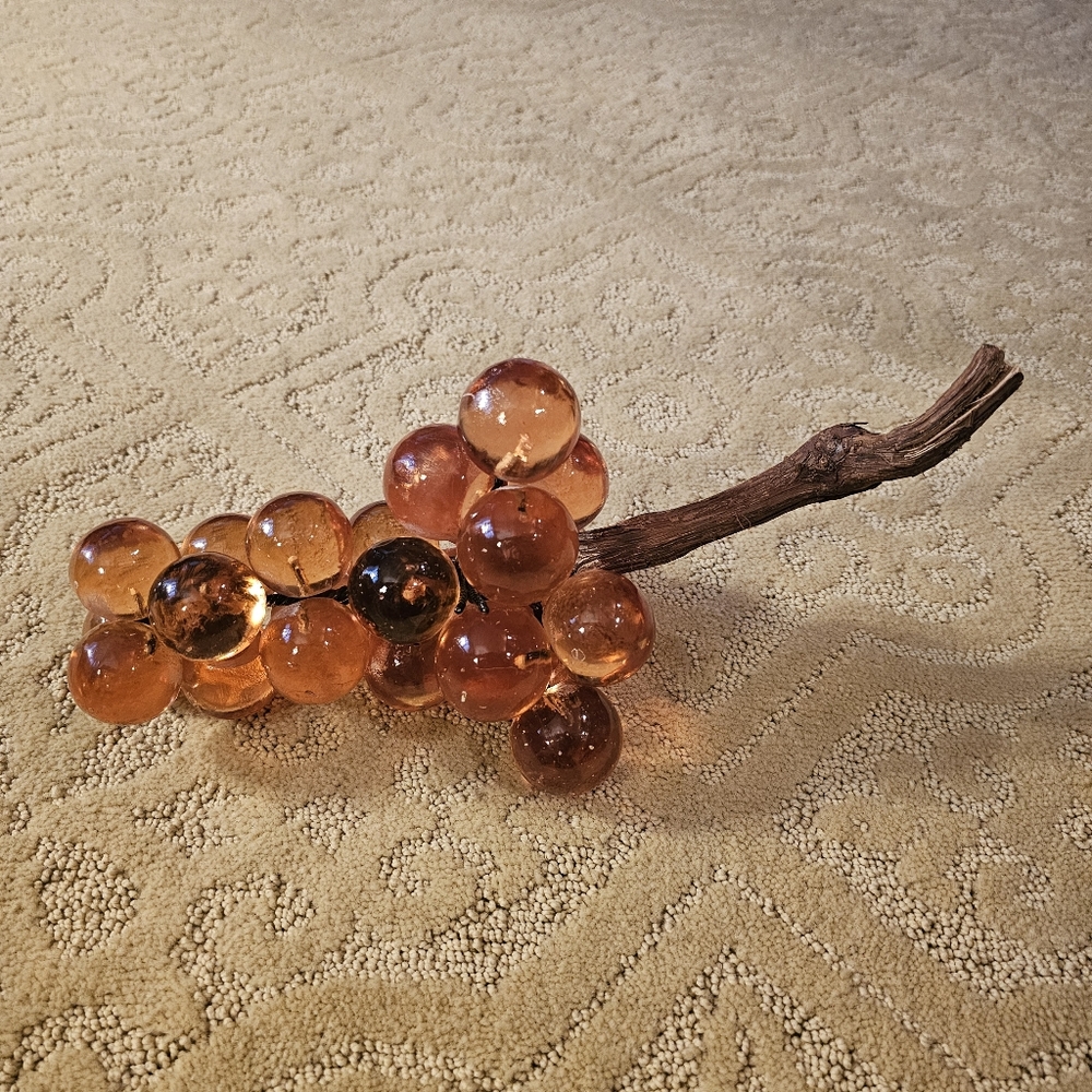 mid-century modern amber Lucite grape cluster with a driftwood stem